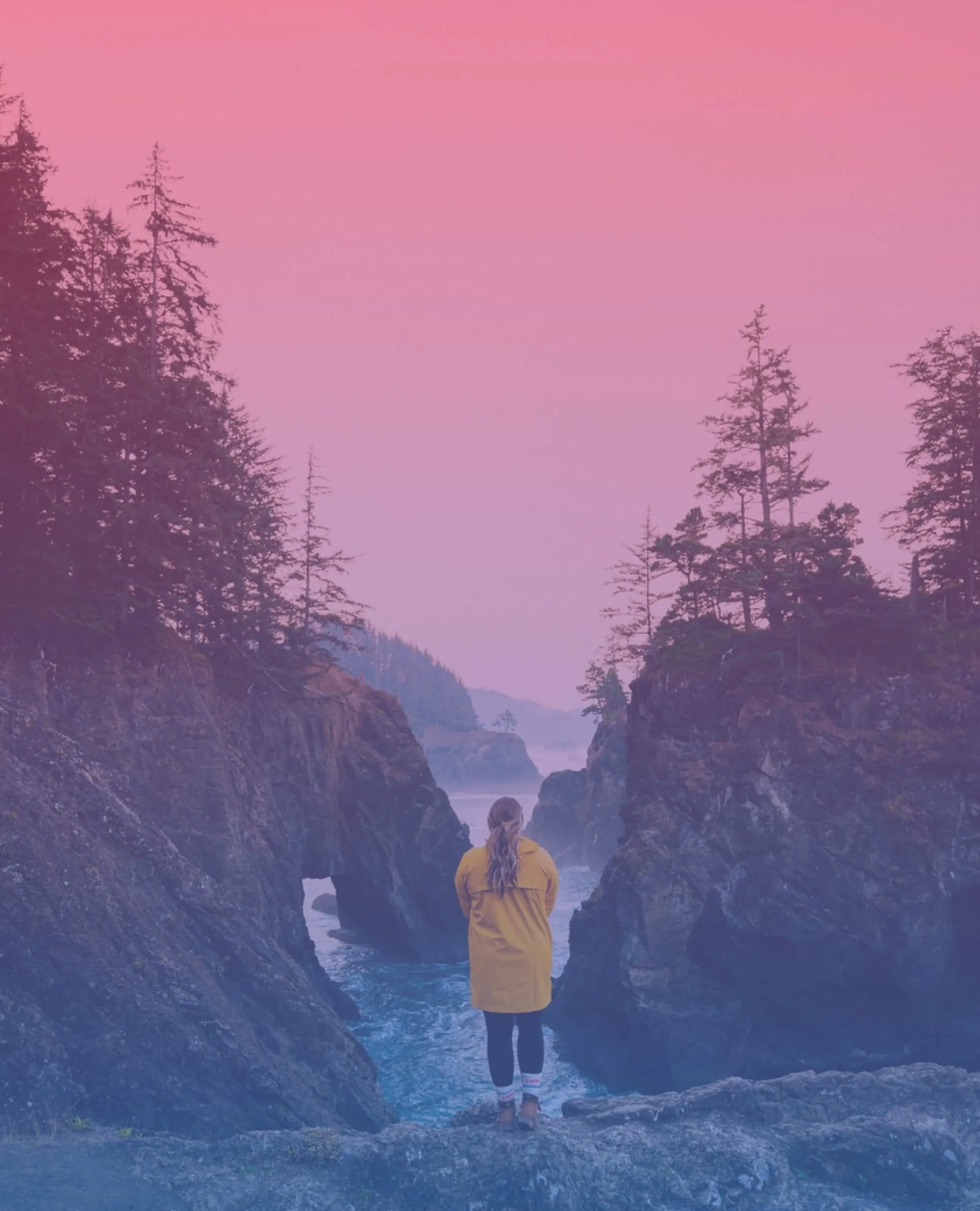 Girl watching on a waterfall from cleave